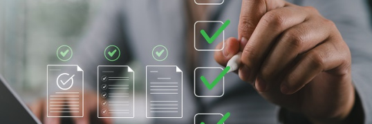 Prepare check and approve concepts. Document management, paperless. Man touching on virtual screen to tick mark documents for online approve paperless quality assurance and ERP management.